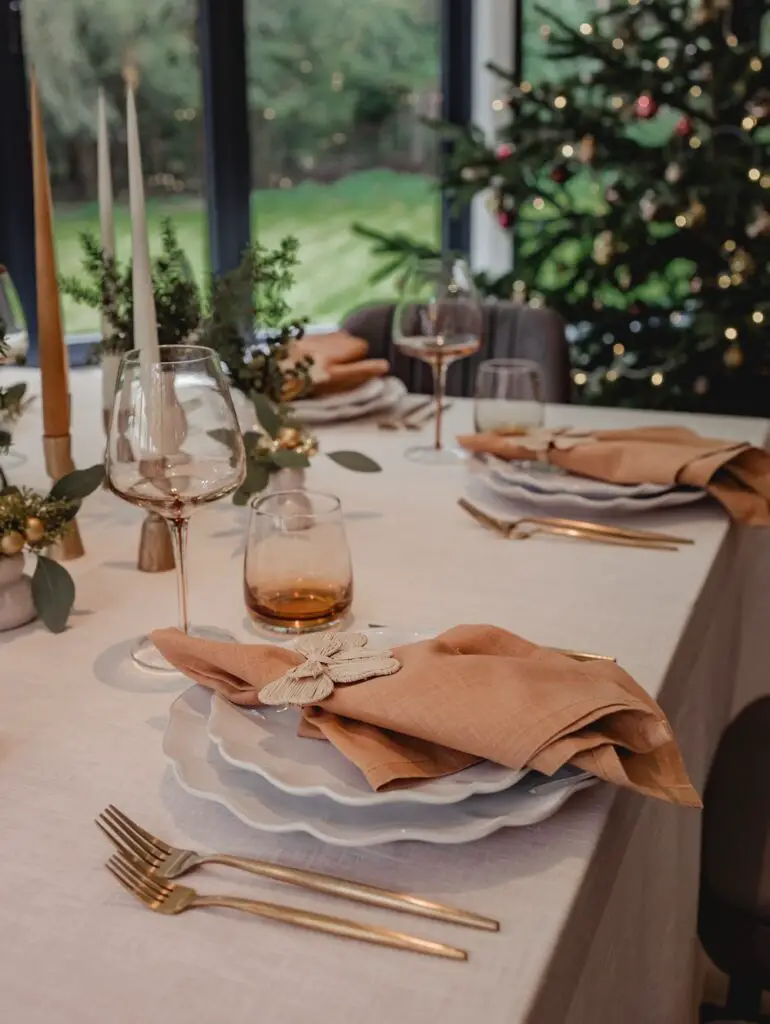 Elegant Table Setting with Blush Napkins and Tall Candle Centerpiece Elegant Table Setting with Blush Napkins and Tall Candle Centerpiece — Christmas Wedding Centerpiece