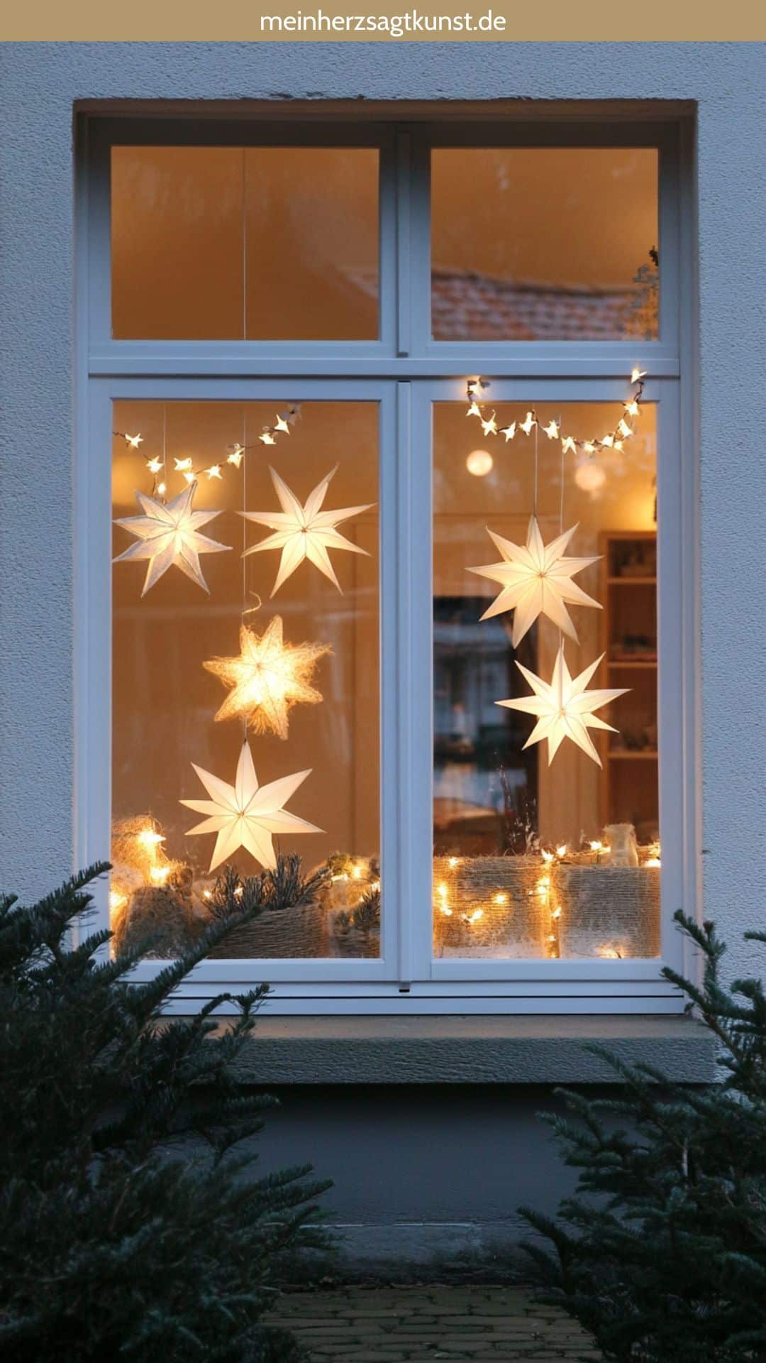 Glowing Paper Star Lanterns and Pine Garland Glowing Paper Star Lanterns and Pine Garland — Christmas Window Decor Outdoor