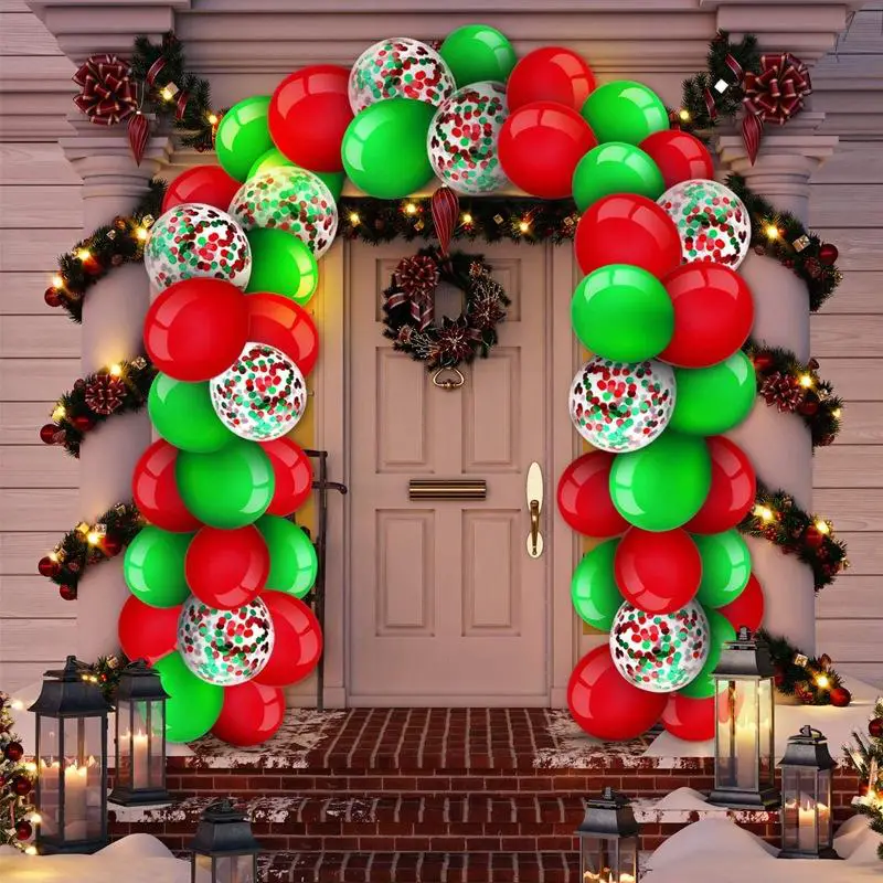 Vibrant Red and Green Balloon Garland Framing a Snowy Evening Front Door — Christmas Balloon Garland