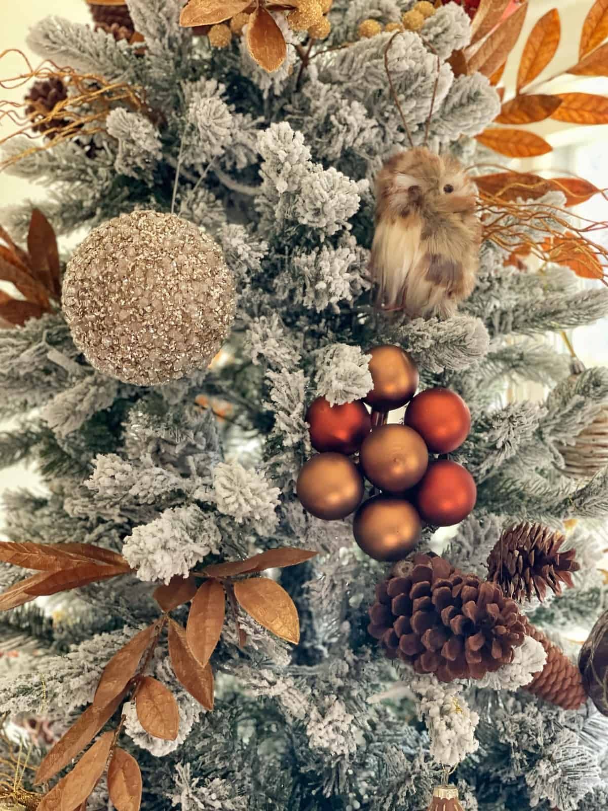 Close-Up of Flocked Tree with Textured Baubles and Owl Ornament Close-Up of Flocked Tree with Textured Baubles and Owl Ornament — Flocked Christmas Tree Decor