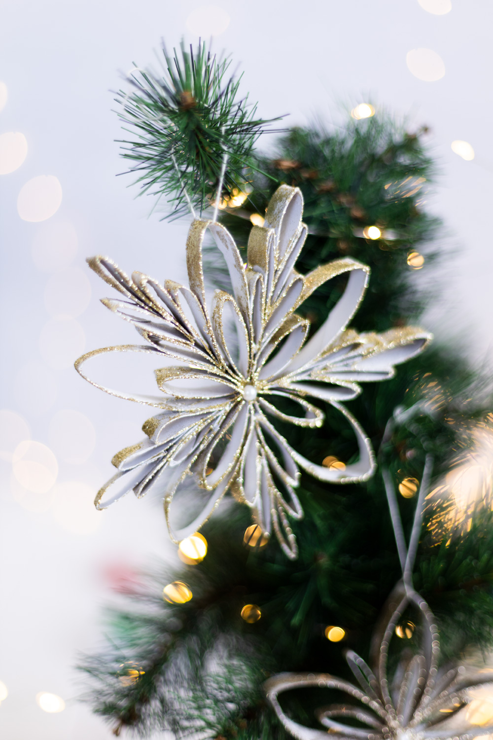 Delicate Paper Snowflake Ornament with Glitter Accents — Christmas Crafts for Adults