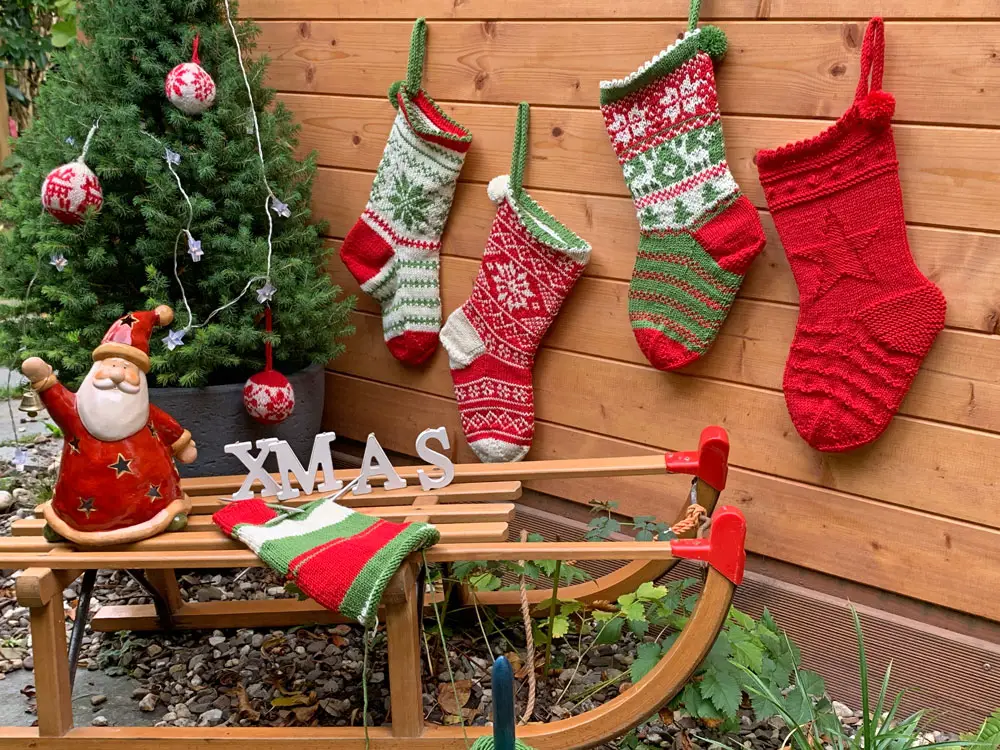 Rustic Outdoor Display of Hand-Knitted Stockings — Christmas Stockings Display