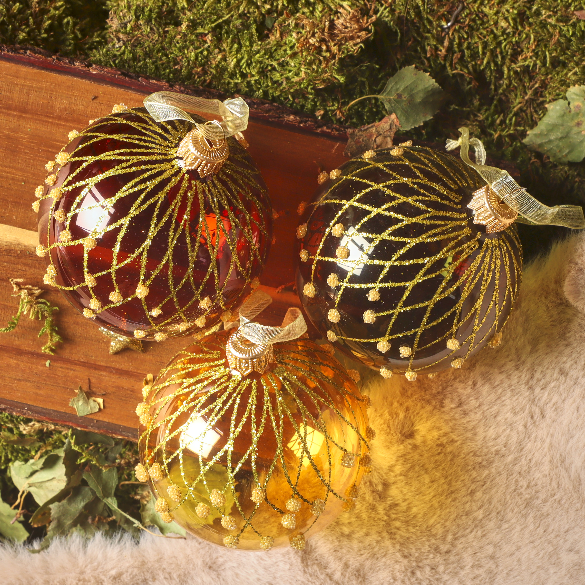 Ornate Gold Detailed Baubles on Textured Surface Ornate Gold Detailed Baubles on Textured Surface — Vintage Christmas Ornaments