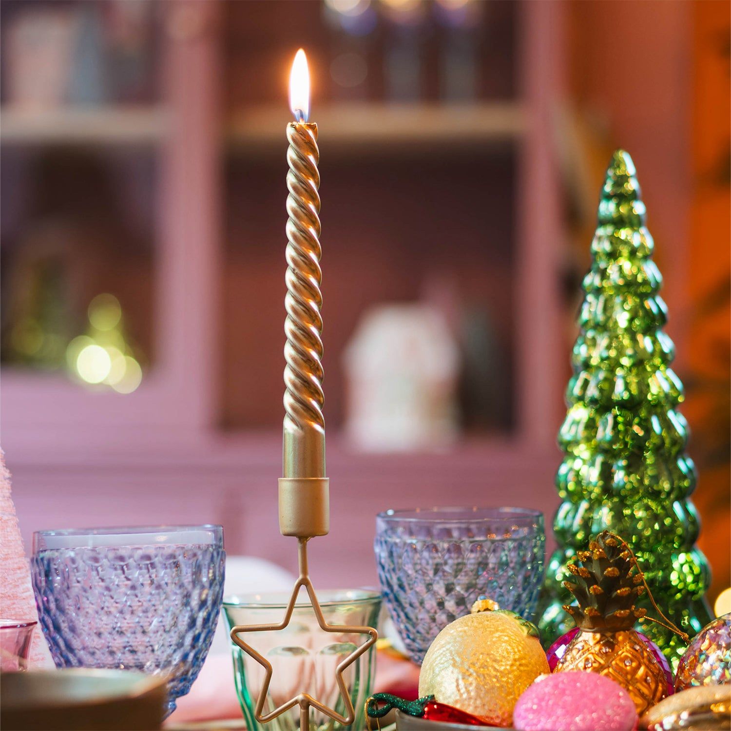 Quirky Tabletop with a Twisted Gold Candle and Star Holder — Christmas Candle Decor