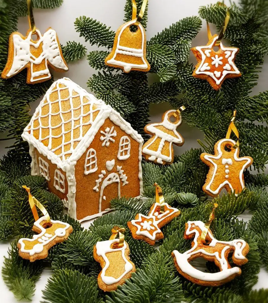 Tabletop Gingerbread House and Ornaments on Pine Branches Tabletop Gingerbread House and Ornaments on Pine Branches — Gingerbread Christmas Decor