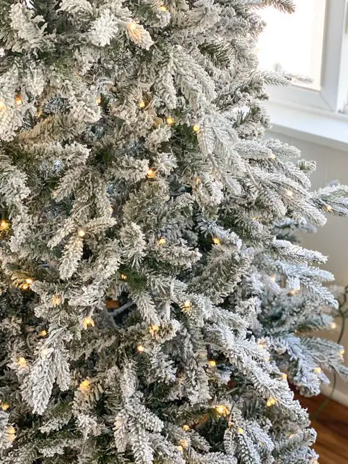 Detailed Texture of Flocked Branches with Warm White Lights Detailed Texture of Flocked Branches with Warm White Lights — Flocked Christmas Tree Decor