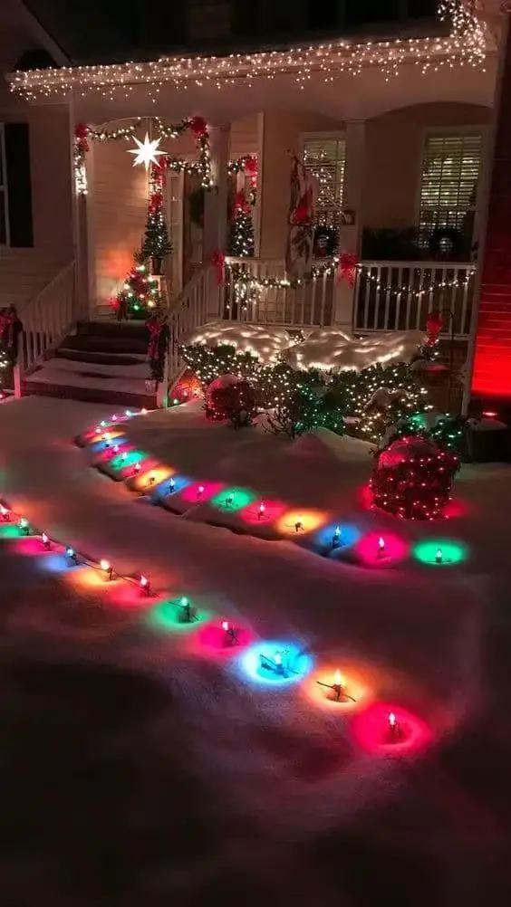 Snowy Front Yard and Porch with Colorful Pathway Lights Snowy Front Yard and Porch with Colorful Pathway Lights — Christmas Light Display Ideas