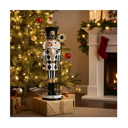 Glamorous Black and Gold Nutcracker by Fireplace Glamorous Black and Gold Nutcracker by Fireplace — Nutcracker Christmas Tree