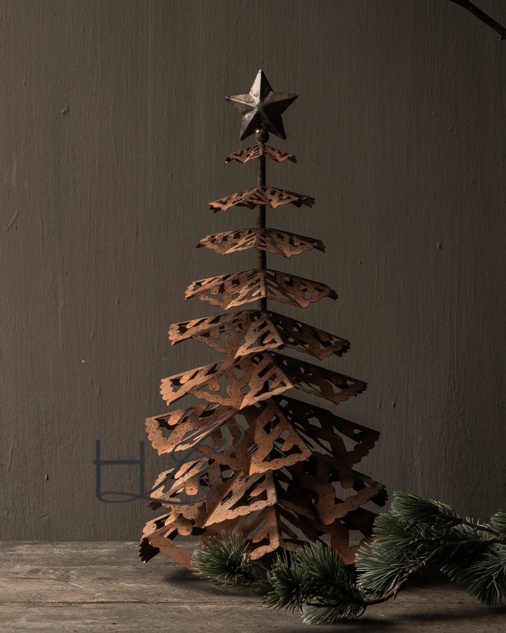 Rustic Tiered Christmas Tree Crafted from Rusted Metal Rustic Tiered Christmas Tree Crafted from Rusted Metal — Dollar Tree Christmas Decor