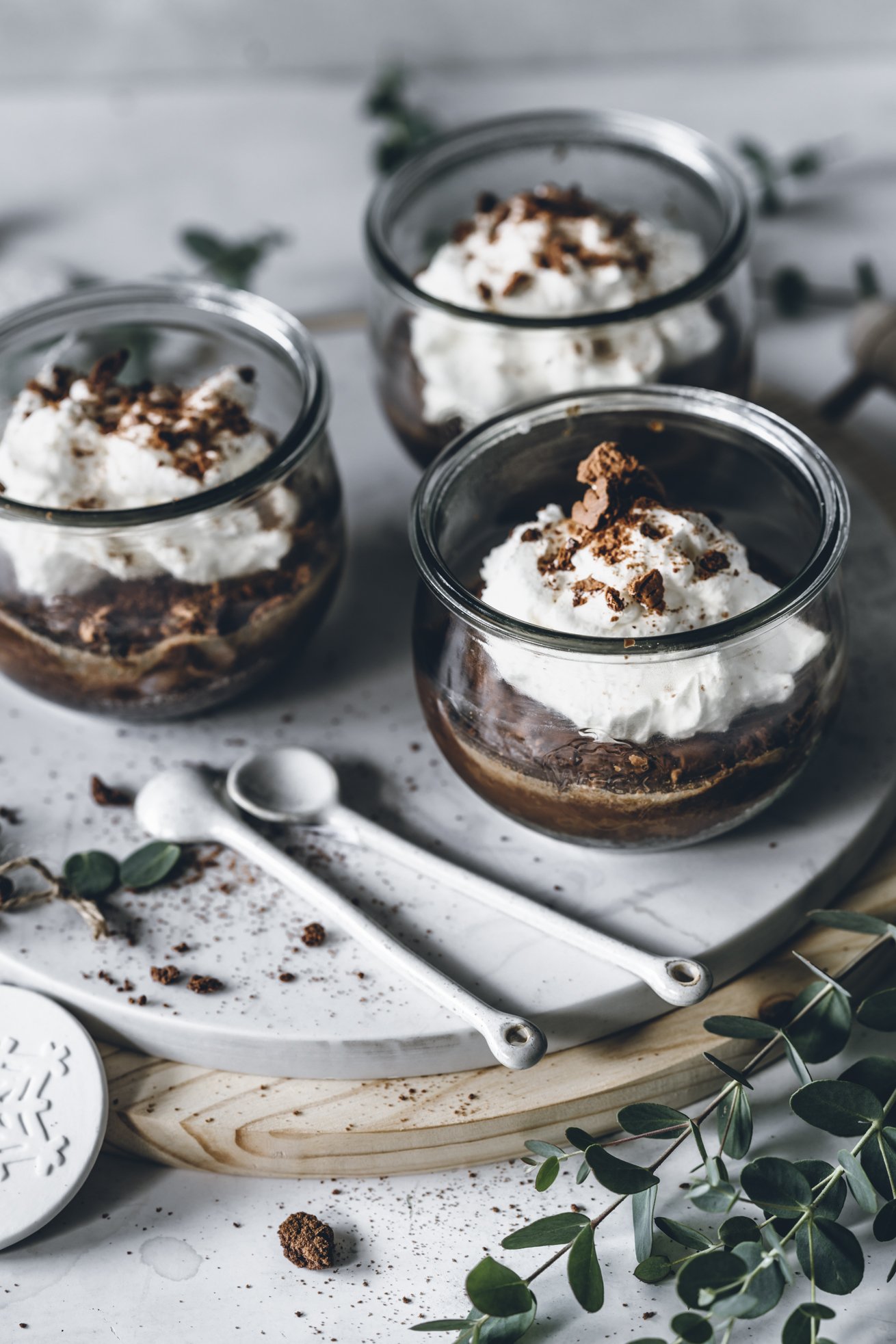 Chocolate Cheesecake Jars with Whipped Cream and Greenery — Christmas Dessert Table