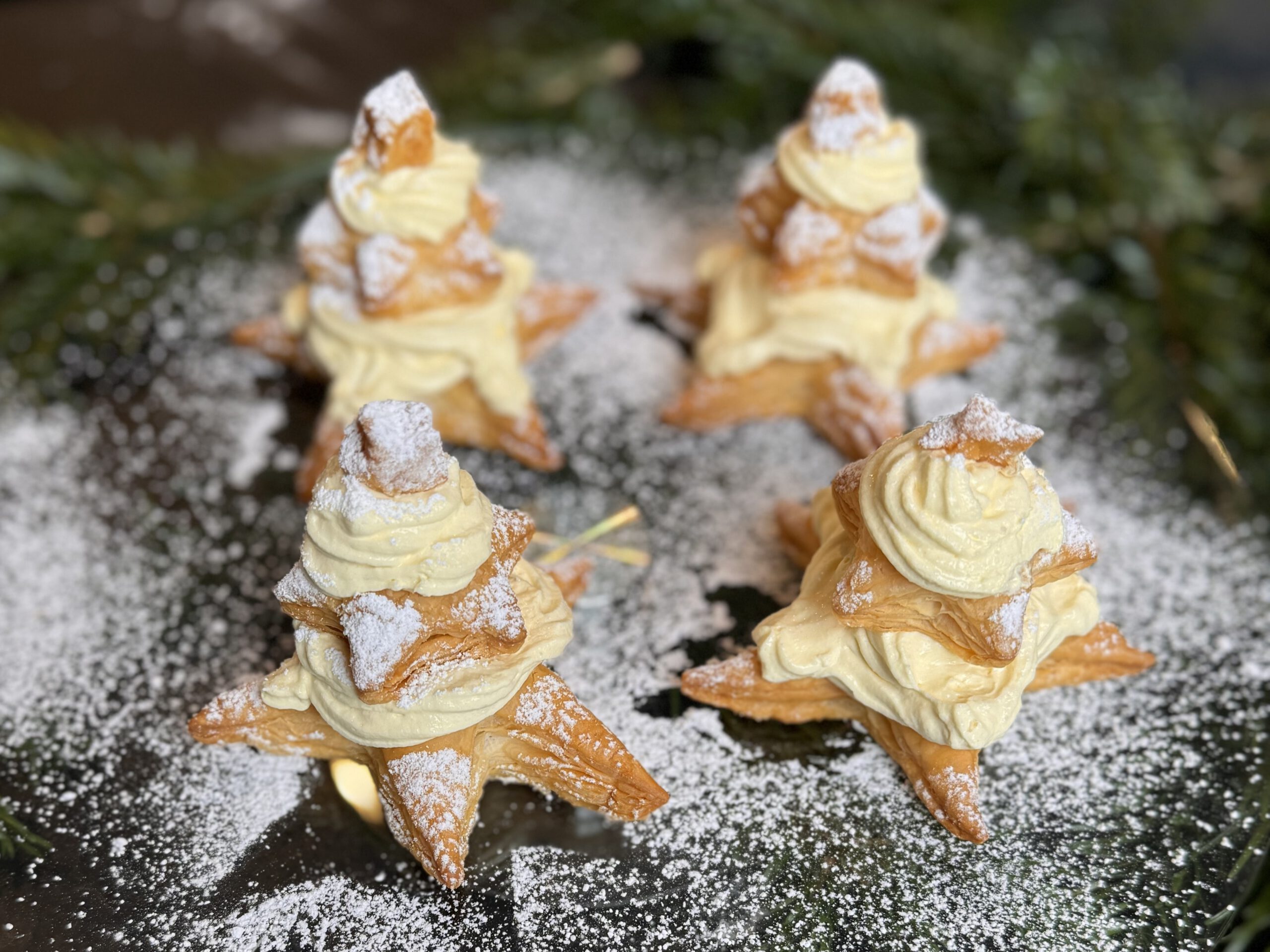 Star-Shaped Pastries with Cream Filling and Powdered Sugar — Christmas Dessert Table