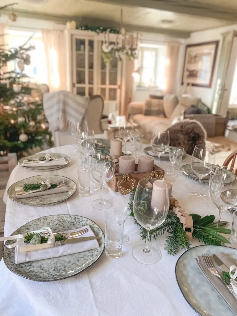 Scandinavian Table Setting with Wooden Reindeer and Pine Sprigs Scandinavian Table Setting with Wooden Reindeer and Pine Sprigs — Christmas Wedding Centerpiece