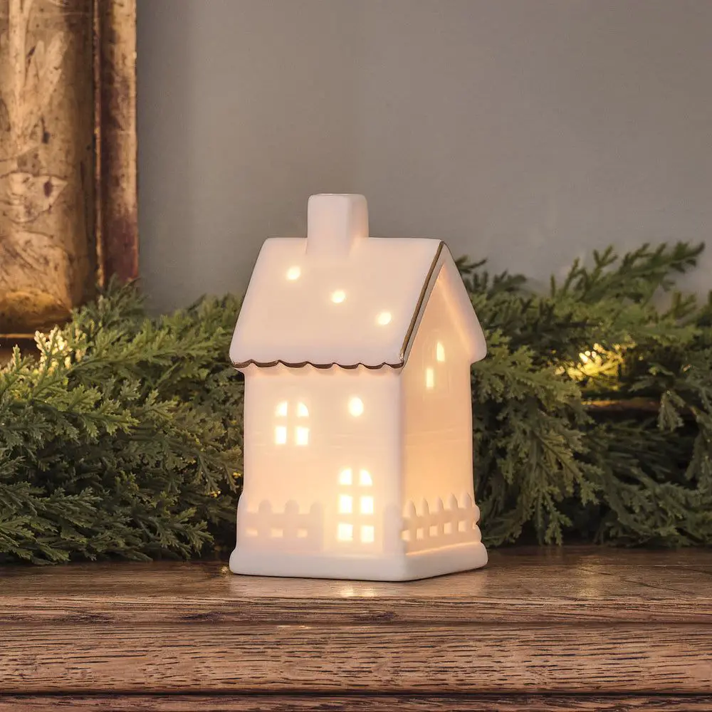 Mantelpiece Decor with Illuminated Ceramic House Mantelpiece Decor with Illuminated Ceramic House — Christmas Light Display Ideas
