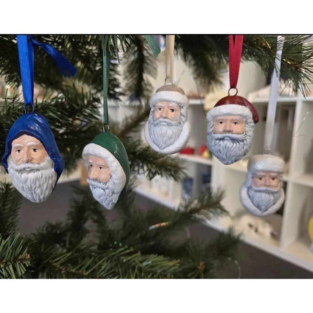 Charming Ceramic Santa Head Ornaments on Tree Branches Charming Ceramic Santa Head Ornaments on Tree Branches — Dollar Tree Christmas Decor