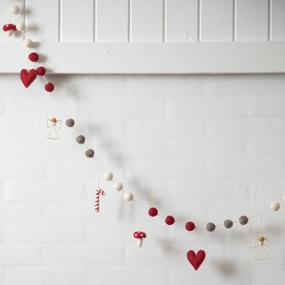 Whimsical Felt Garland with Charms on a Paneled Wall — Christmas Garland