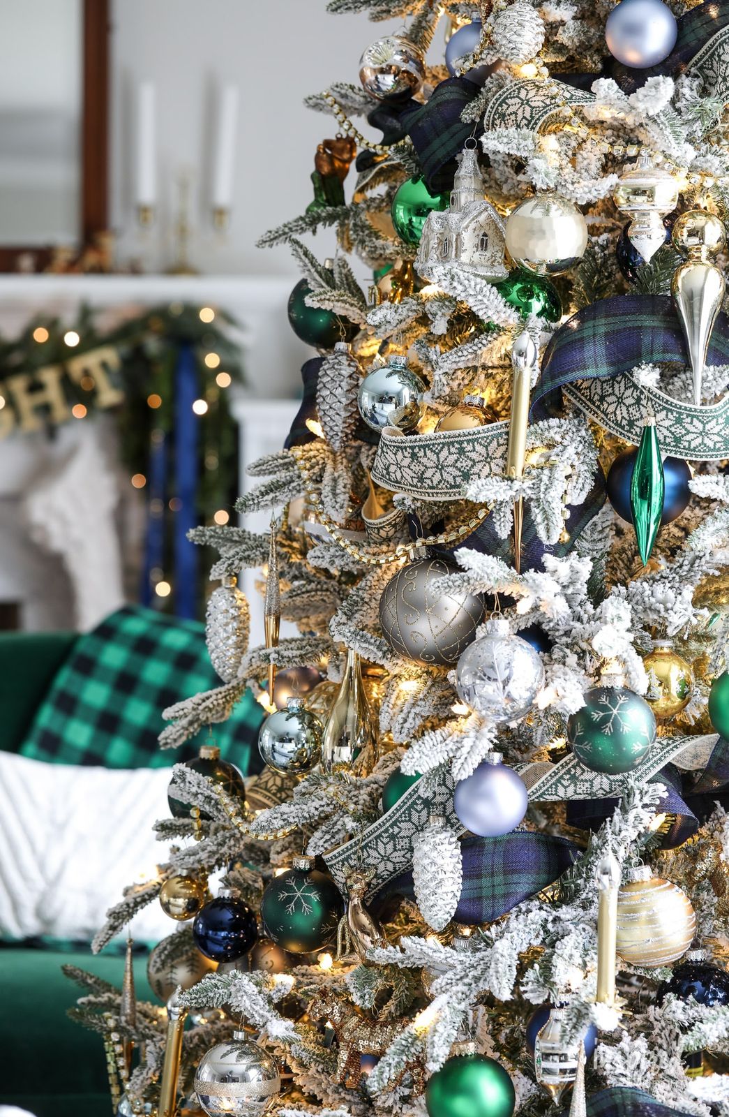 Richly Decorated Flocked Tree with Plaid Ribbon and Mini Houses Richly Decorated Flocked Tree with Plaid Ribbon and Mini Houses — Flocked Christmas Tree Decor
