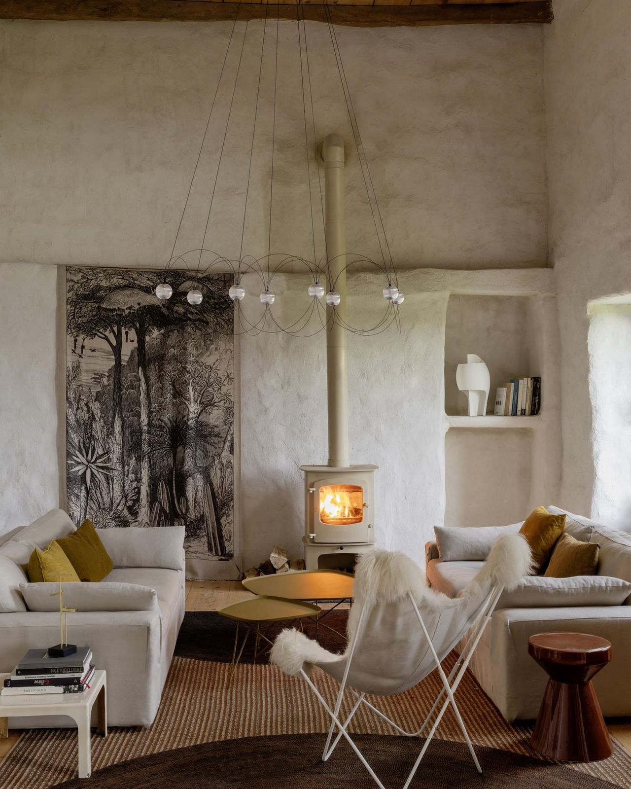 Cottage Living Room Centered Around a Wood-Burning Stove — Winter Mantel Decor
