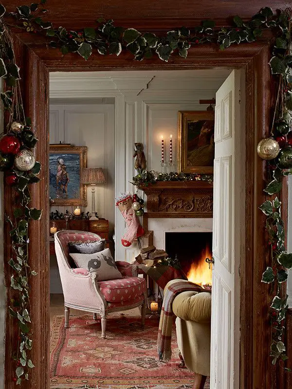 Vintage Charm: Pink Armchair by a Garlanded Fireplace — Cozy Christmas Living Room