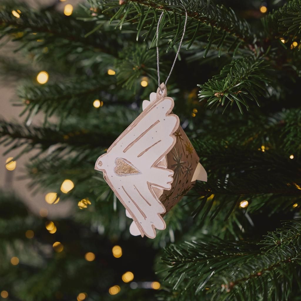 Delicate Paper Dove Ornament on a Tree Branch Delicate Paper Dove Ornament on a Tree Branch — Small Christmas Tree Decor
