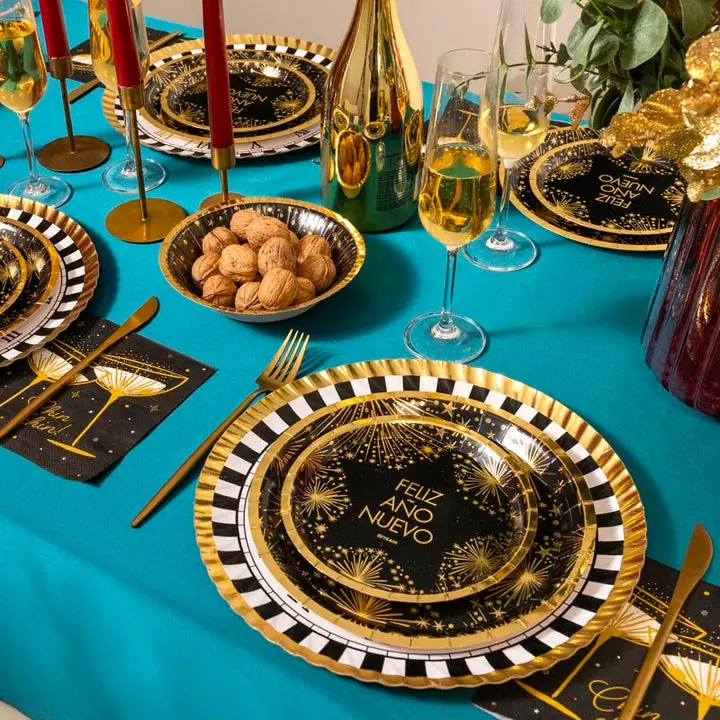 Festive Gold-Rimmed Plates with Firework Designs — Gold New Years Eve Decor