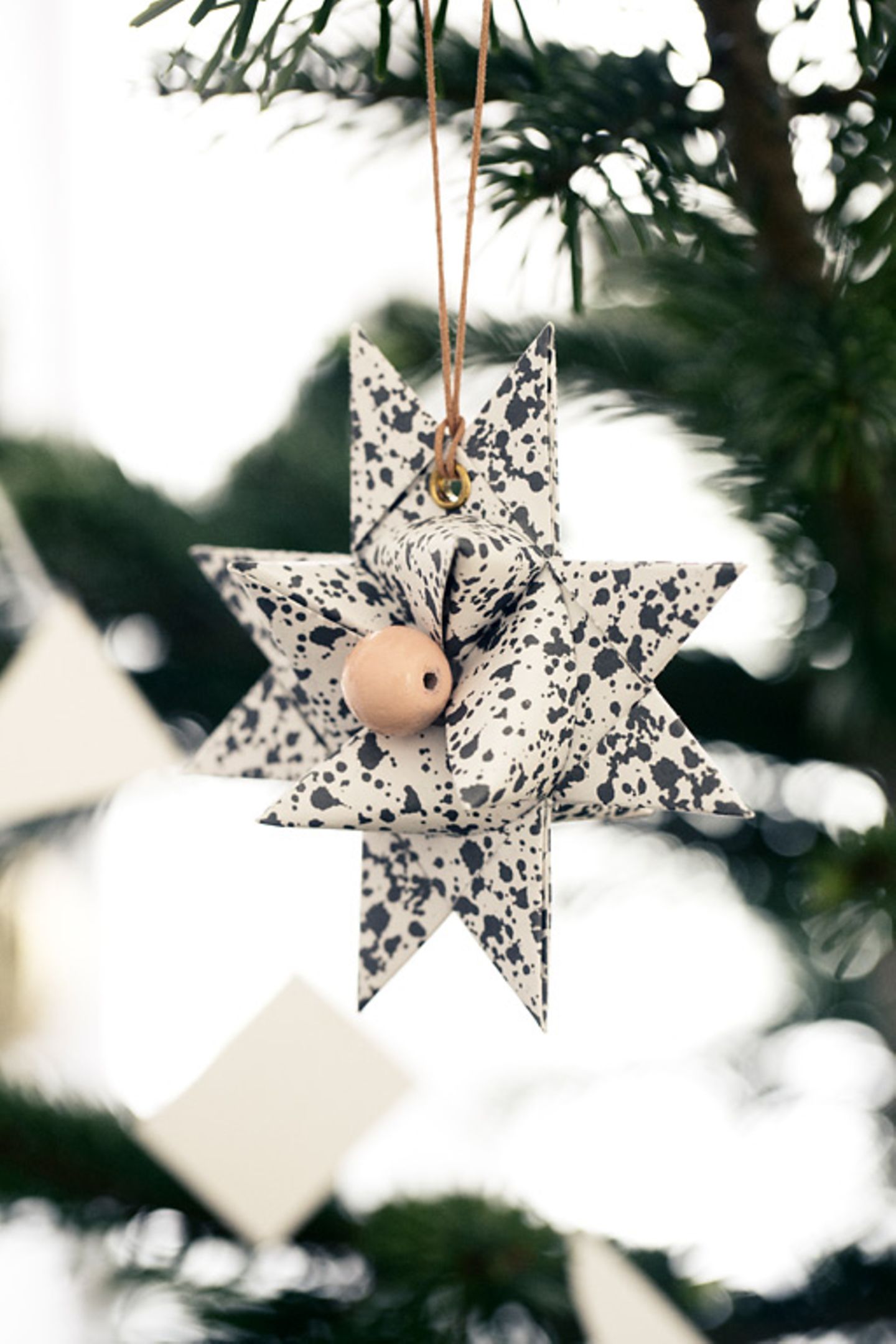 Graphic Folded Paper Star Ornament with Speckled Pattern — Christmas Crafts for Adults