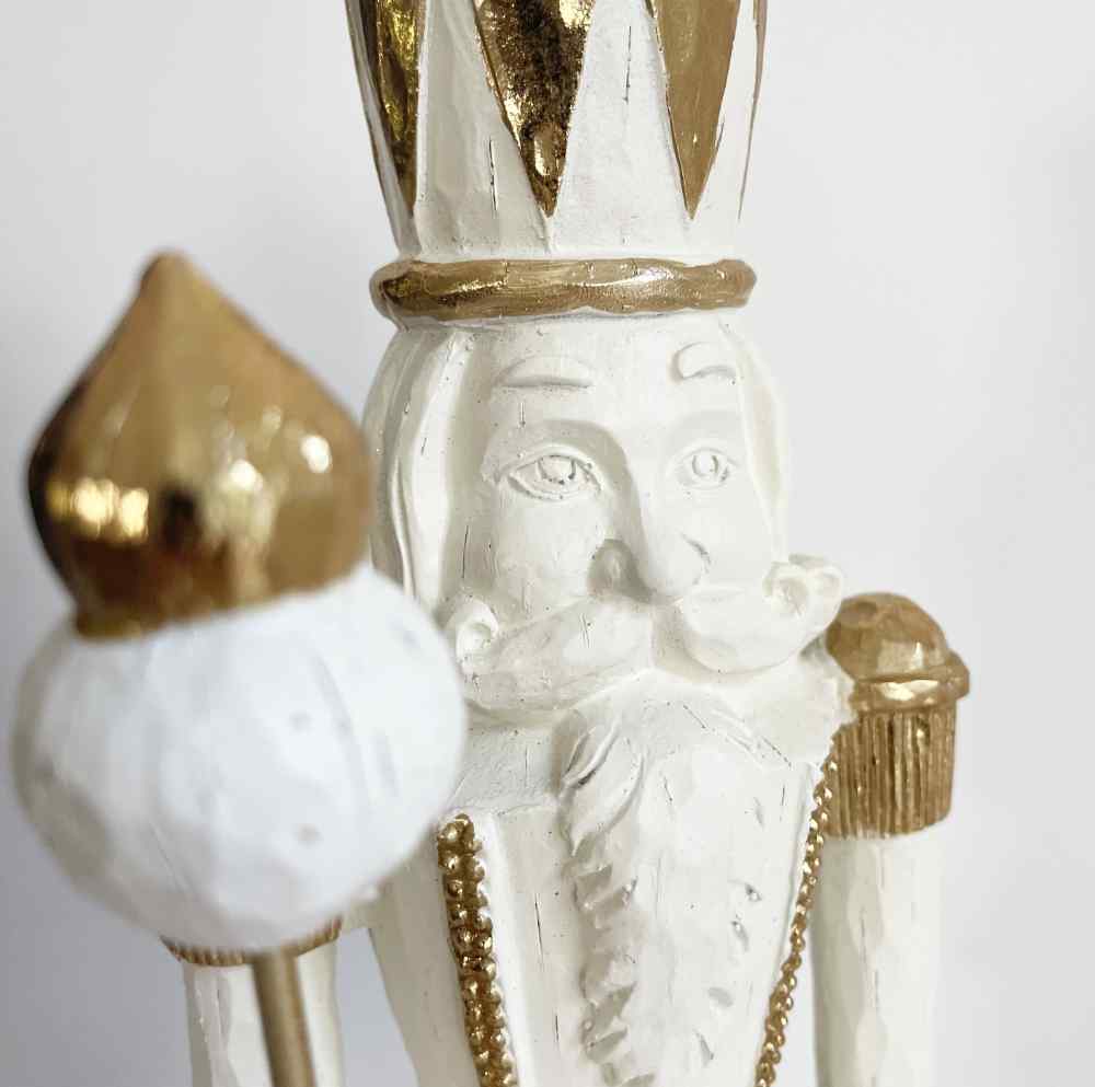 Close-Up of Elegant White and Gold Nutcracker Face Close-Up of Elegant White and Gold Nutcracker Face — Nutcracker Christmas Tree