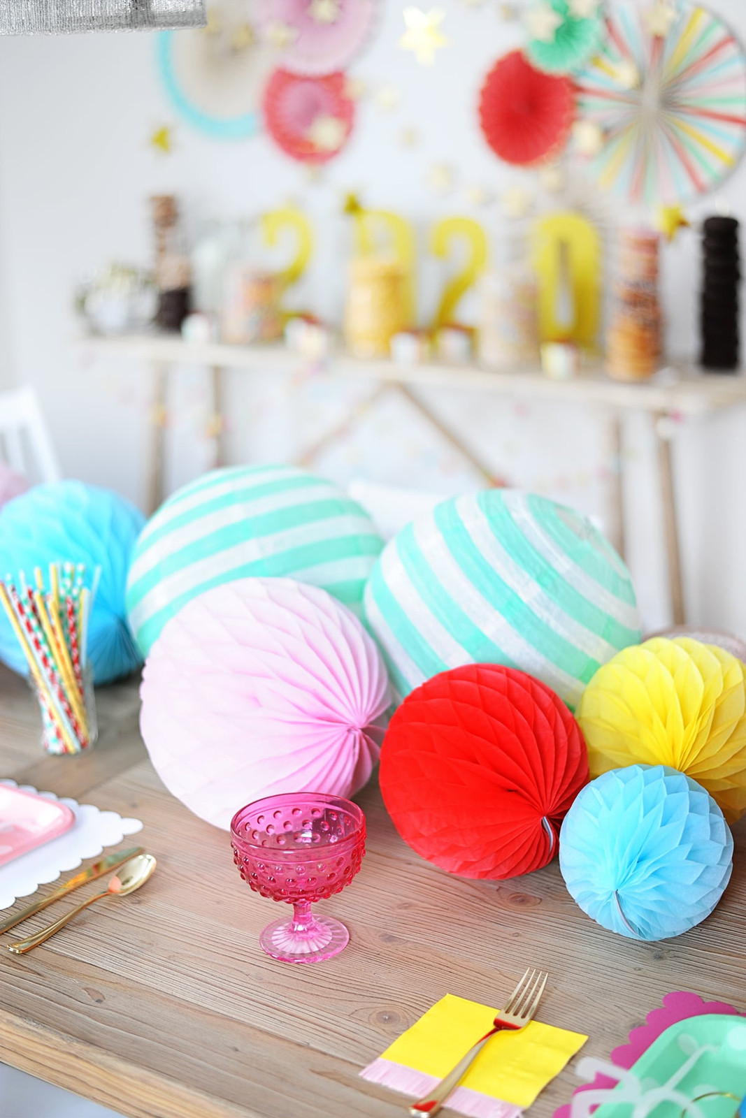 Colorful Tabletop with Honeycomb Balls and Paper Fans — New Years Eve Party for Kids