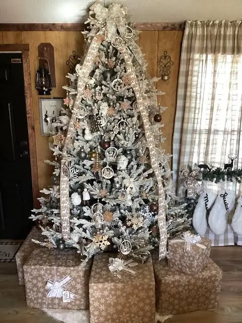 Rustic Flocked Tree with Snowflake Gifts and White Stockings Rustic Flocked Tree with Snowflake Gifts and White Stockings — Flocked Christmas Tree Decor