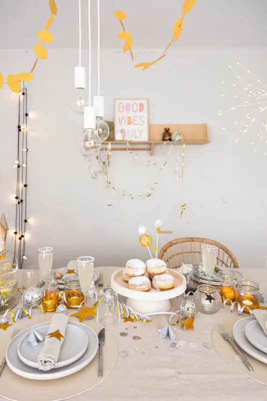 Modern Festive Table with Abundant Confetti and String Lights Modern Festive Table with Abundant Confetti and String Lights — New Years Eve Party Decor