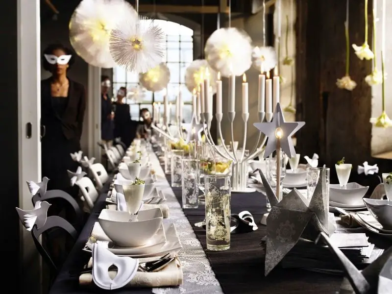 Modern Minimalist Dining with White Paper Decorations and Candelabra — Christmas Dining Room Decor
