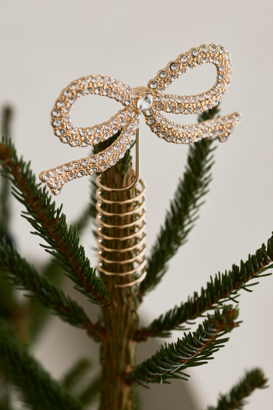 Rhinestone Encrusted Gold Bow Topper for a Touch of Sparkle Rhinestone Encrusted Gold Bow Topper for a Touch of Sparkle — Christmas Tree Topper