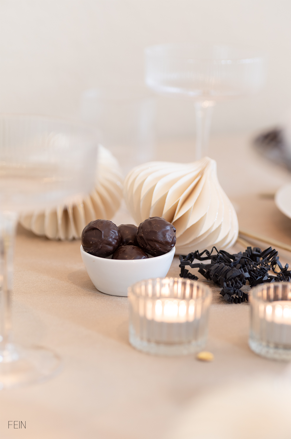Minimalist Bowl of Dark Chocolate Truffles by Candlelight — New Years Eve Dessert Table