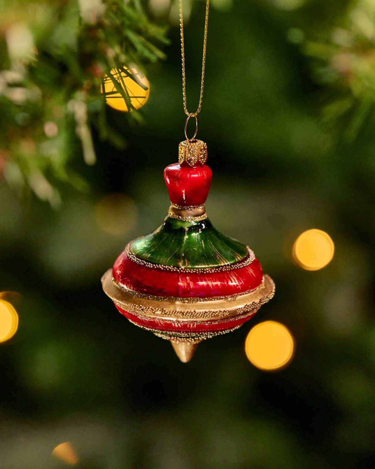 Intricate Red and Green Glass Spinning Top Christmas Ornament Intricate Red and Green Glass Spinning Top Christmas Ornament — Red and Green Christmas Tree