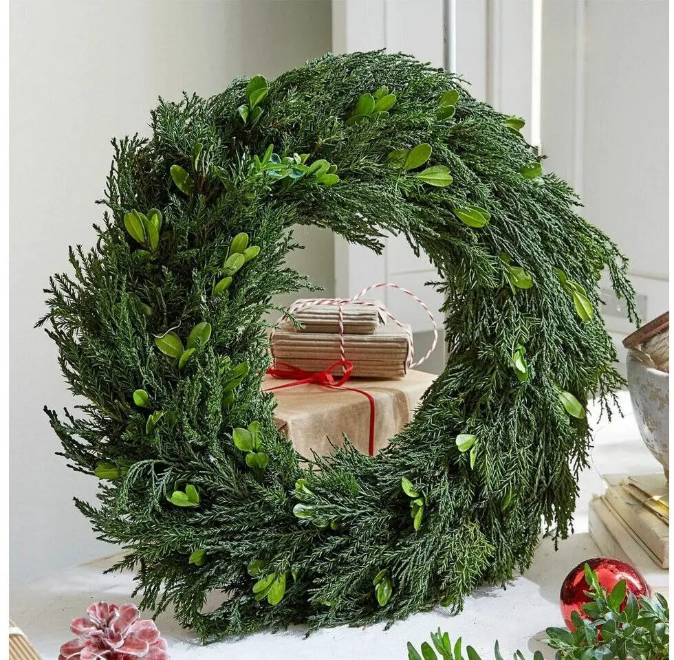Natural Evergreen Wreath Encircling Gift Boxes Natural Evergreen Wreath Encircling Gift Boxes — Sage Green Christmas Decor