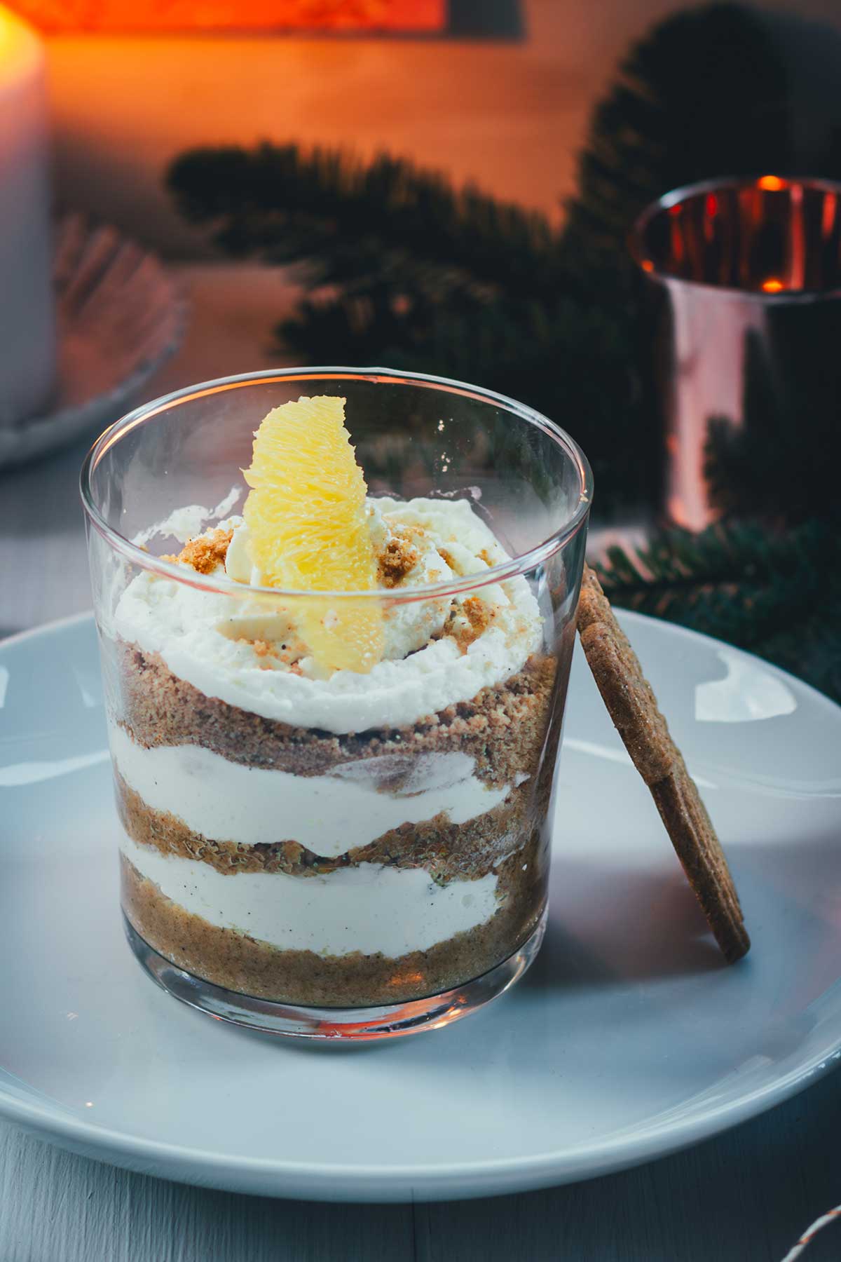 Layered Citrus Dessert with Candlelight and Pine — Christmas Dessert Table