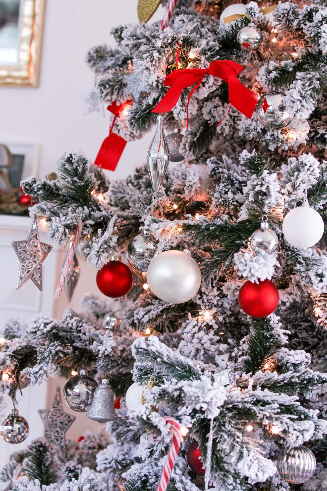 Flocked Christmas Tree Branches with Red Ribbon and Silver Ornaments — Glam Christmas Tree
