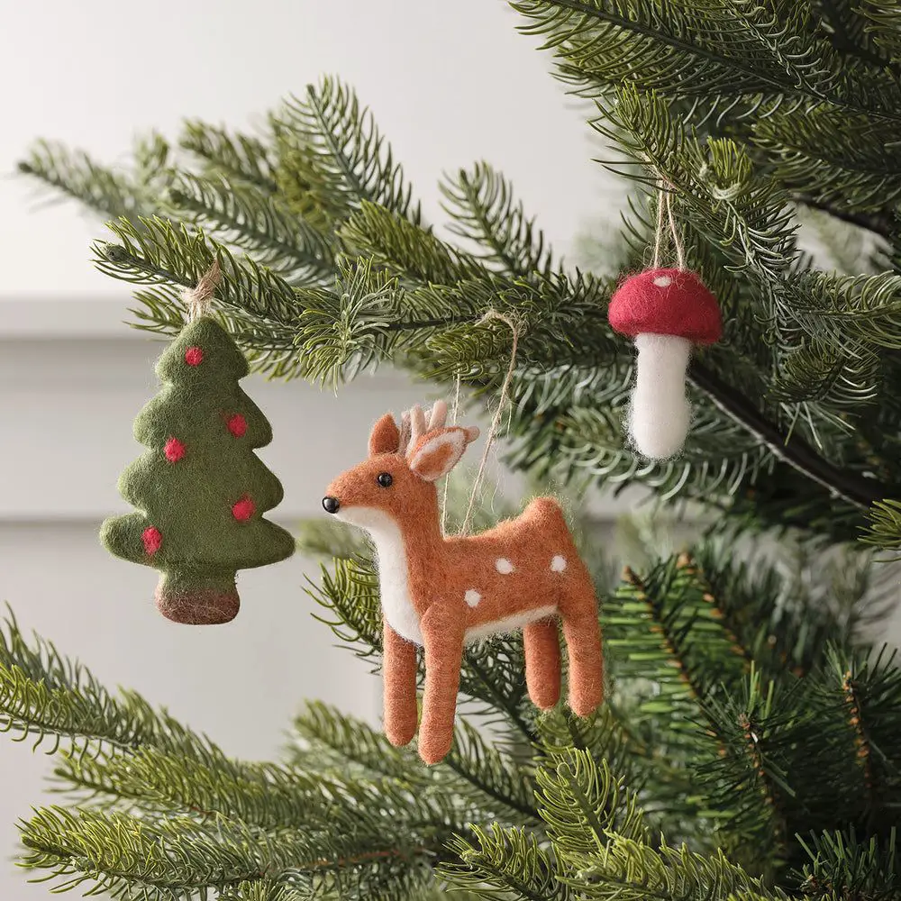 Whimsical Felt Ornaments on a Green Tree Whimsical Felt Ornaments on a Green Tree — Small Christmas Tree Decor