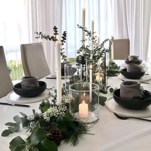 Minimalist Linear Centerpiece with Tall White Candles and Greenery Minimalist Linear Centerpiece with Tall White Candles and Greenery — Christmas Wedding Centerpiece