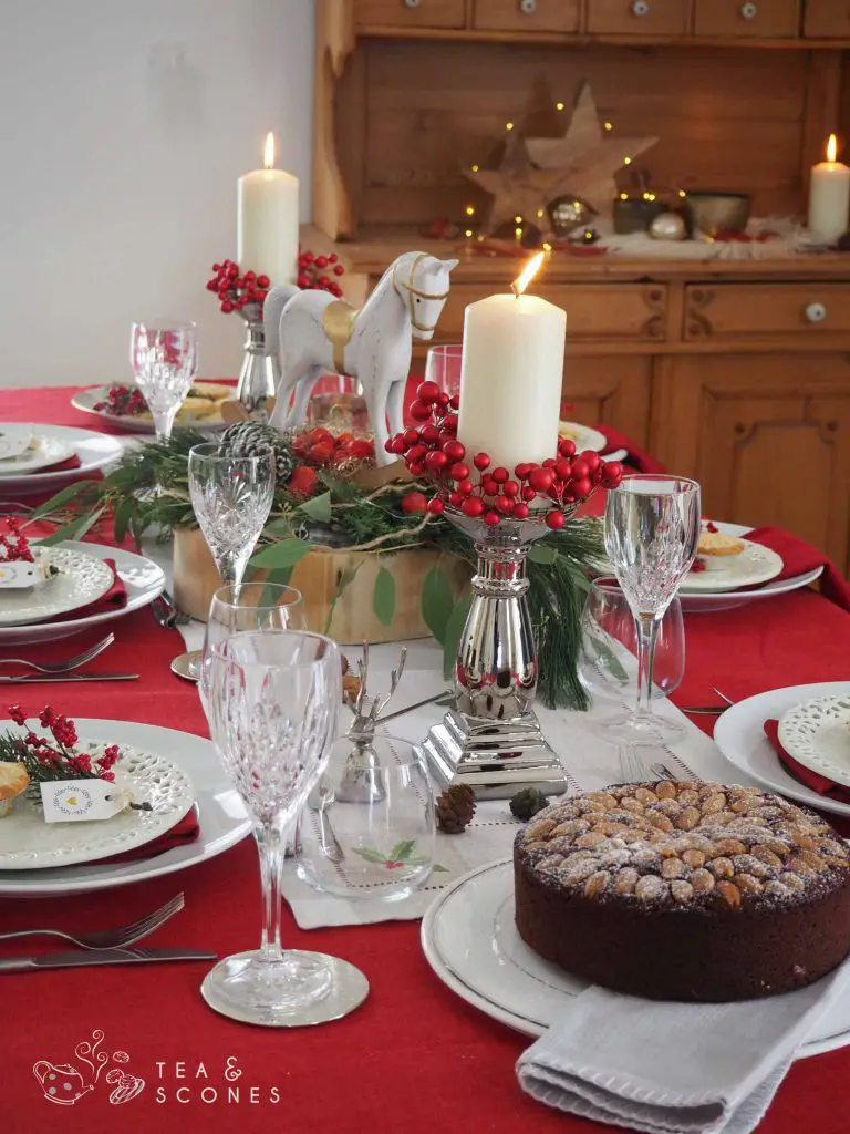 Traditional British Dining Table with Pillar Candles and Berry Garland — Christmas Candle Decor