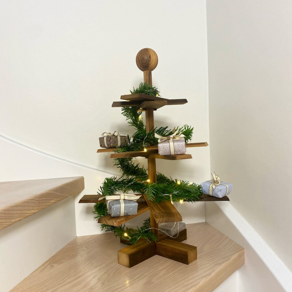 Corner Wooden Christmas Tree with Greenery and Gifts — Minimalist Christmas Tree