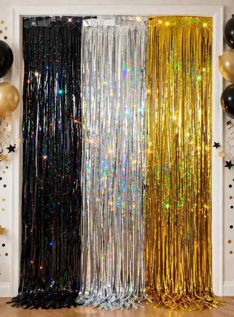 Shimmering Metallic Fringe Curtains as a Festive Backdrop Shimmering Metallic Fringe Curtains as a Festive Backdrop — New Years Eve Party Decor