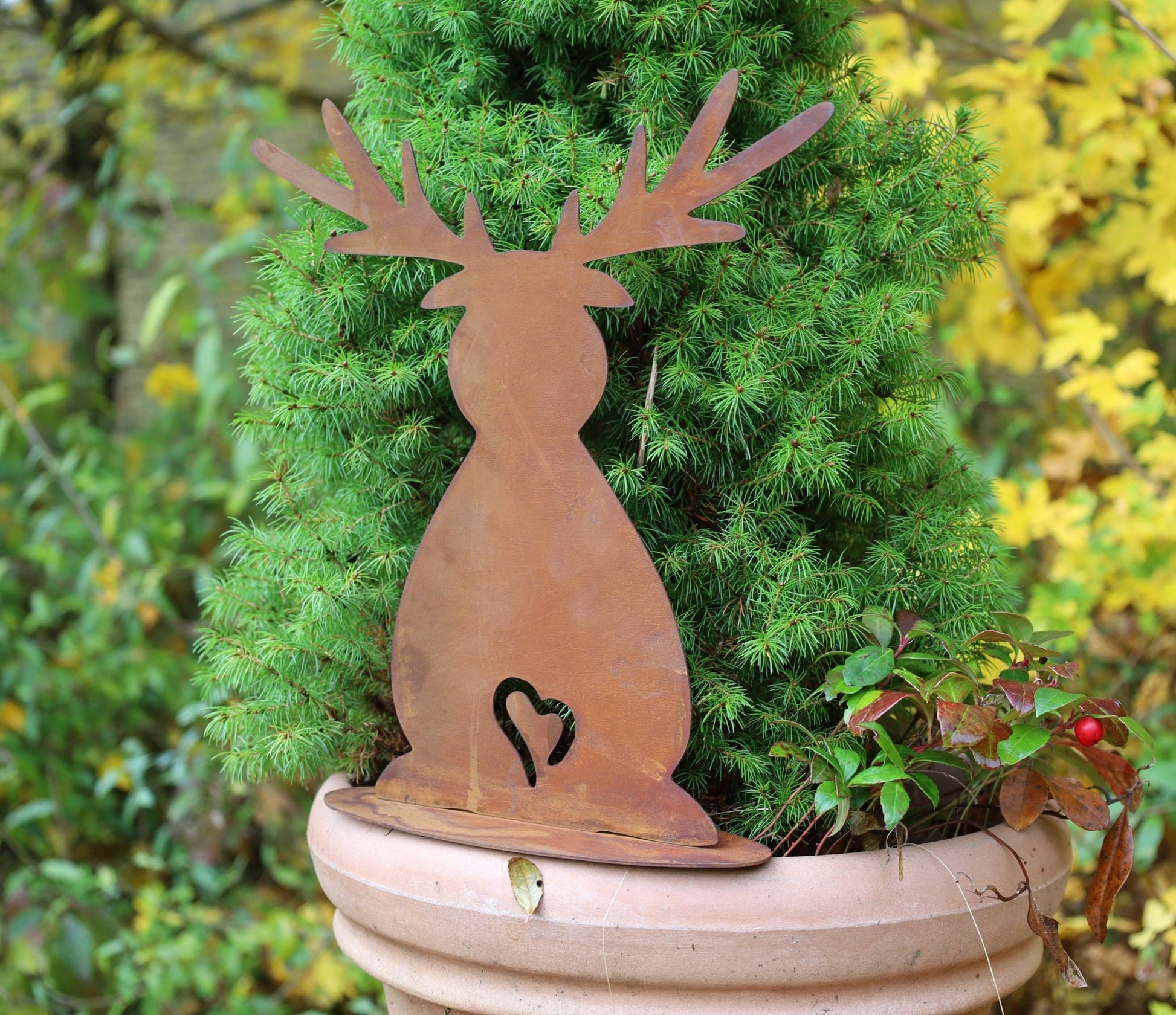 Place a Metal Reindeer Silhouette in a Planter Place a Metal Reindeer Silhouette in a Planter — Simple Christmas Outdoor Decor