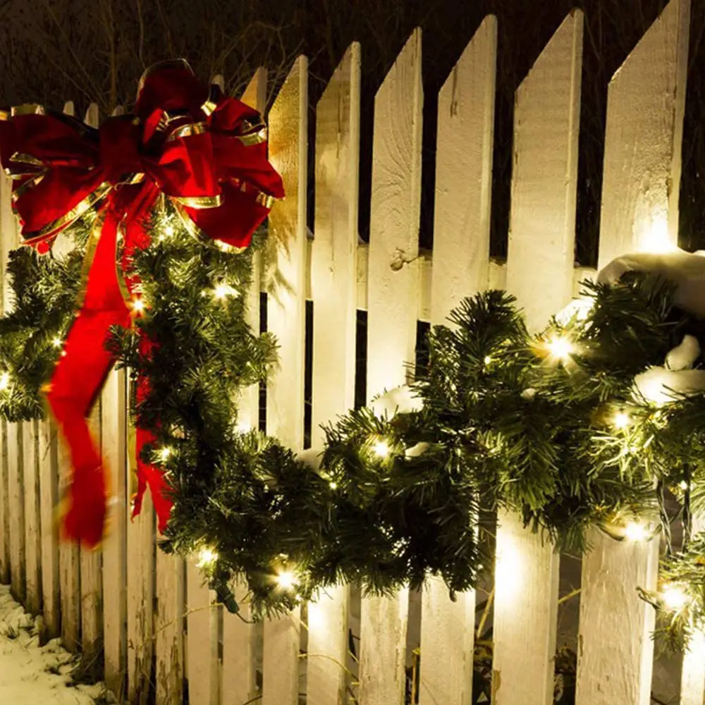 Outdoor Picket Fence Garland with Red Velvet Bow and Fairy Lights — Christmas Garland