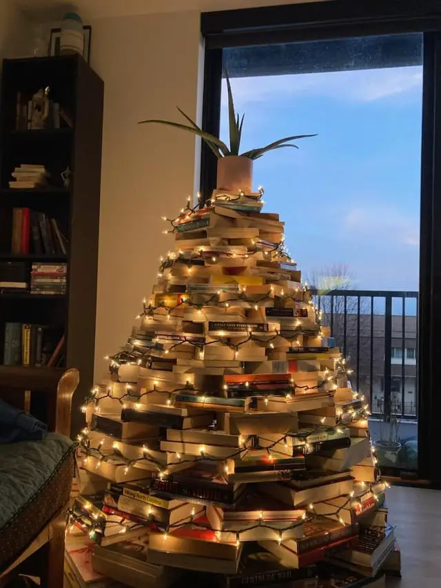 Creative Christmas Tree Constructed from Stacked Books Creative Christmas Tree Constructed from Stacked Books — Dollar Tree Christmas Decor