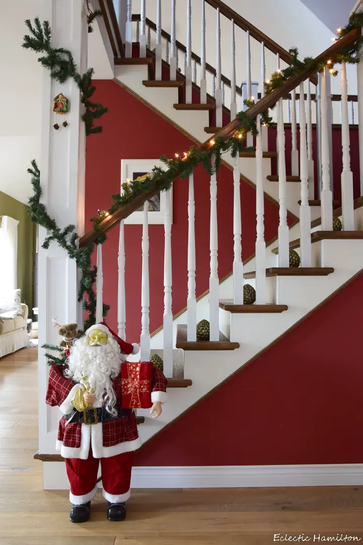Kitschy Garland with a Large Santa Figure at the Base — Christmas Stair Garland