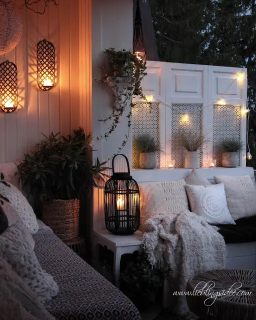 Boho Porch Seating with Layered Textiles and Warm Lighting — Winter Porch Decor