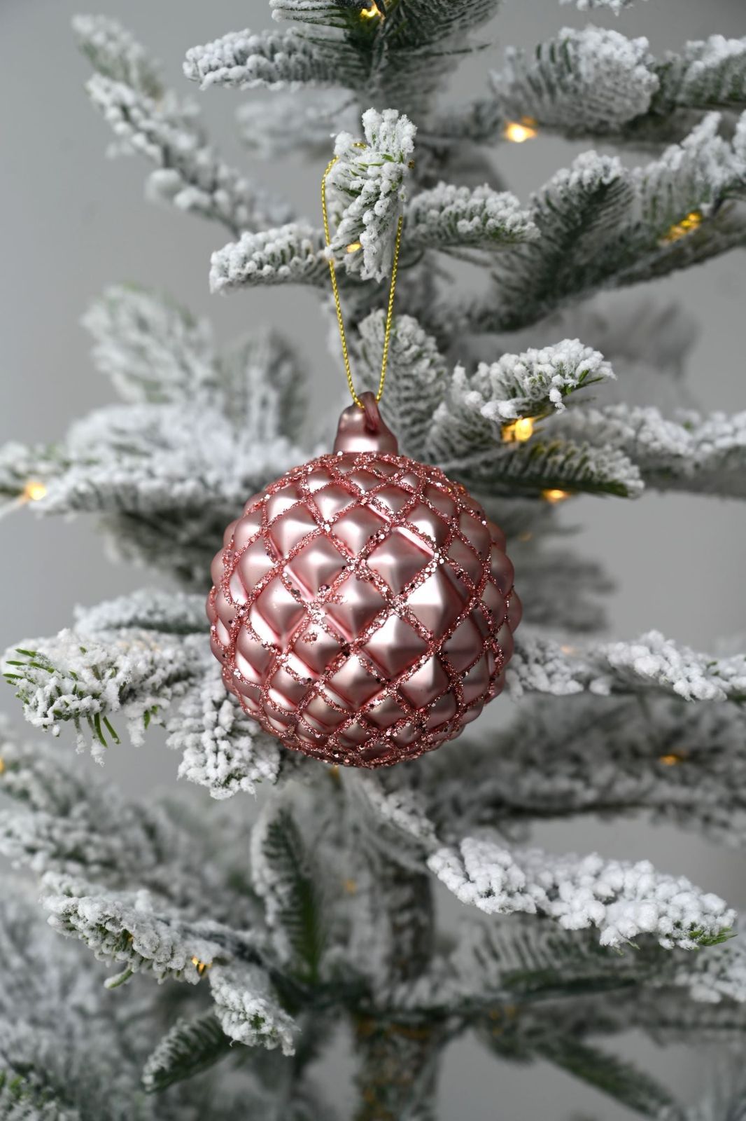 Modern Pink Glitter Bauble on a Flocked Tree Branch — Pink and Gold Christmas Tree