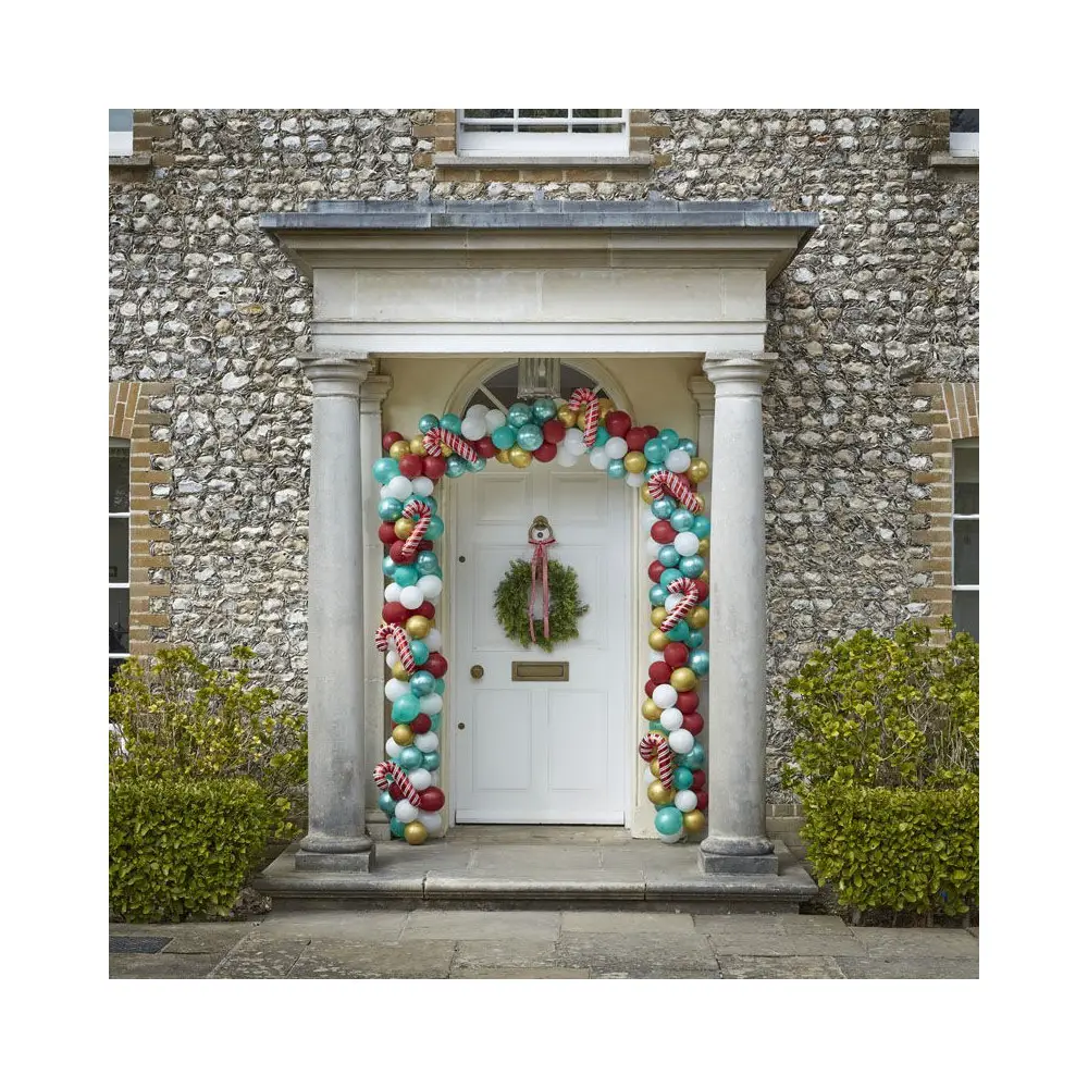 Festive Balloon Garland with Candy Cane Balloons Framing a White Front Door — Christmas Balloon Garland