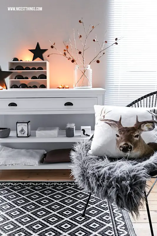 Scandinavian Console Table with Copper Accents and Deer Cushion — Christmas Living Room Decor