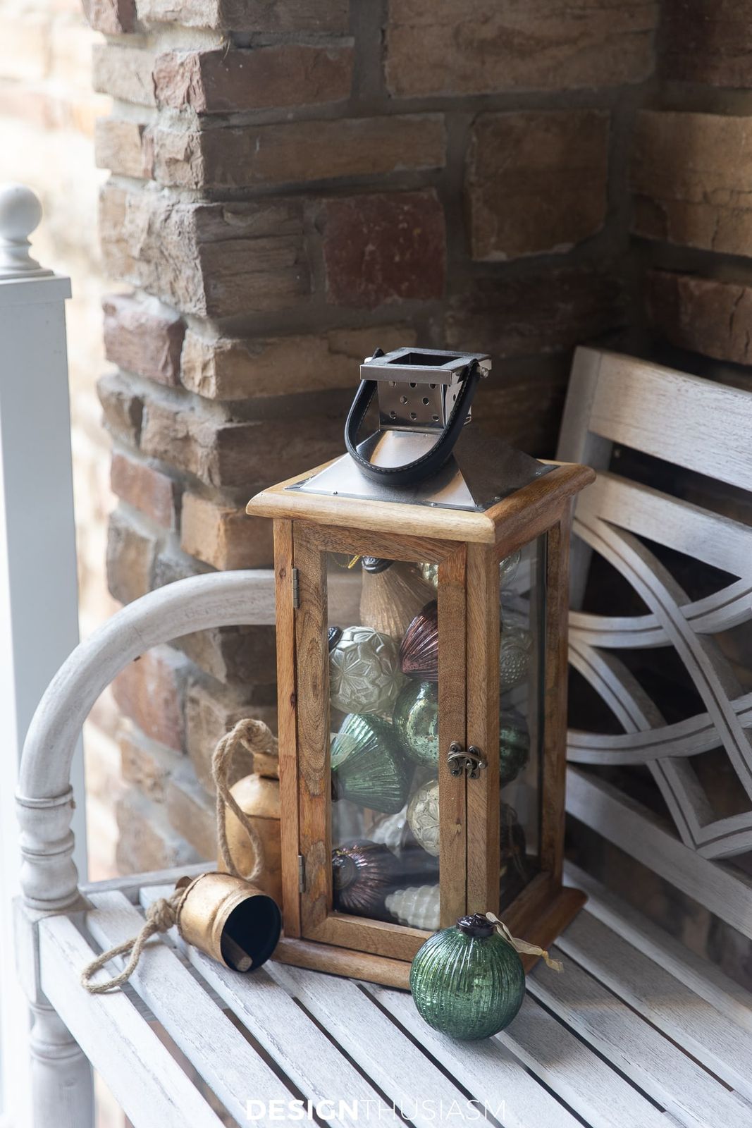 Style a Rustic Lantern with Ornaments on a White Bench — Christmas Porch Lanterns